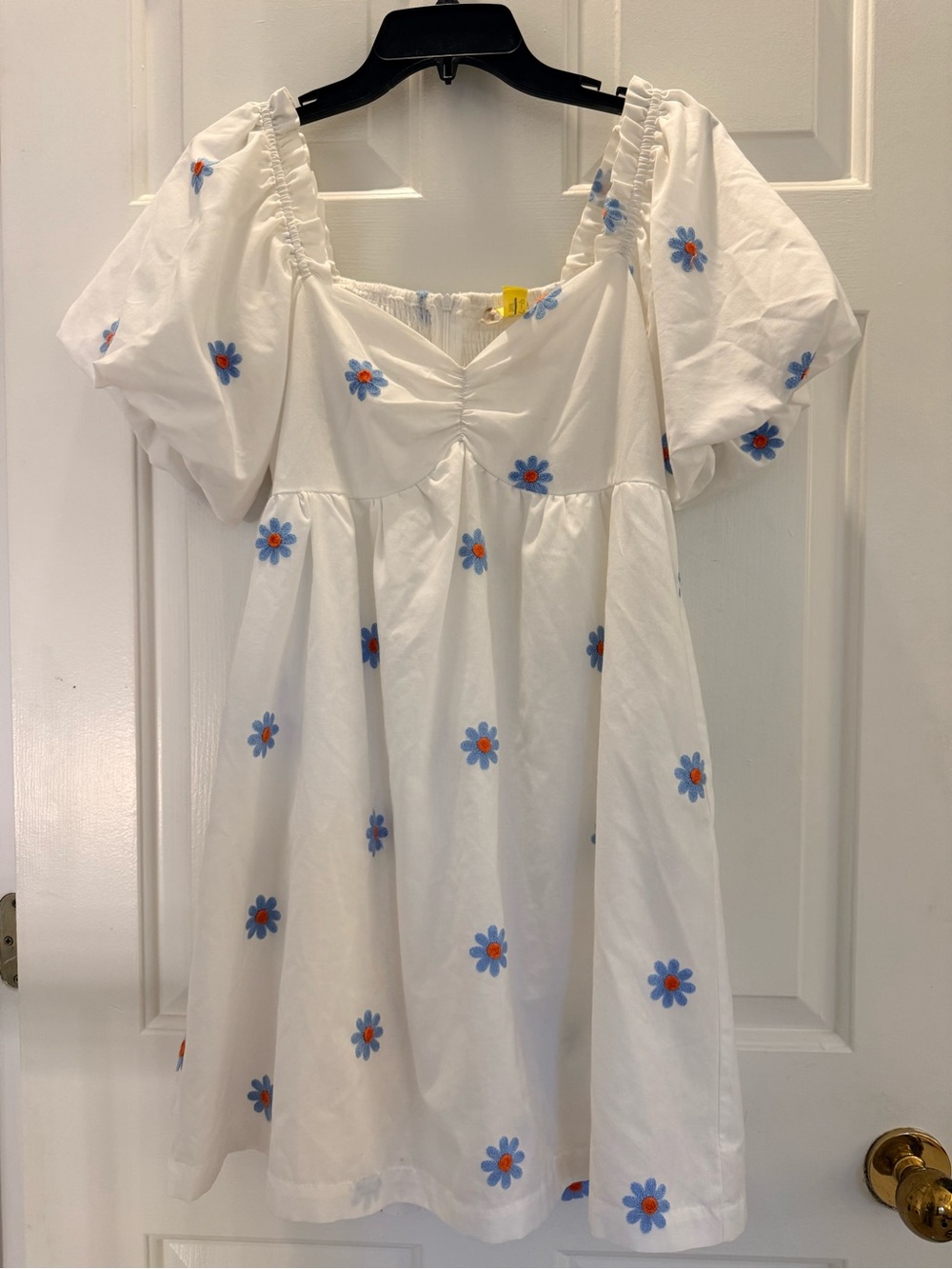 Altered State White dress with Blue flowers with orange center.